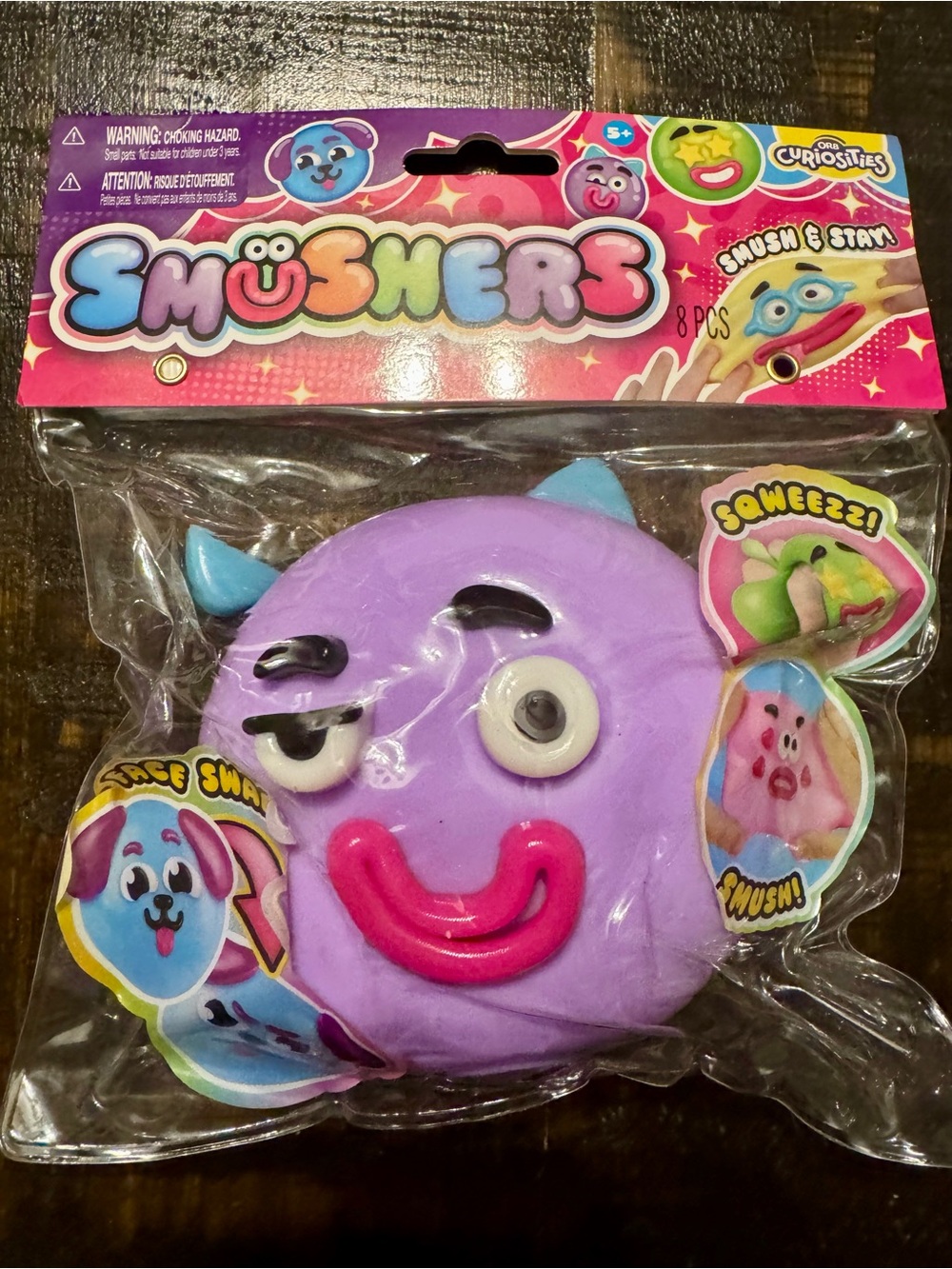 Smushers Purple Swap-Face Squishy Toy with Pink Smile